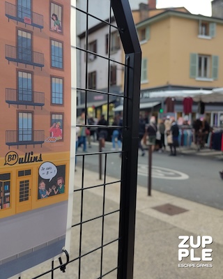 Un extrait des énigmes de Zupple pendant la braderie d’Oullins dont l’enseigne du magasin « BD Oullins »